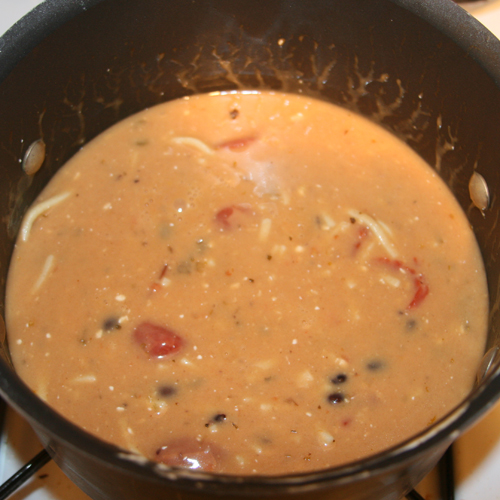 Combine all cans (drain only the black beans) into a pot. Add 2 oz. of neufchatel or cream cheese. Stir. Simmer 10 minutes.